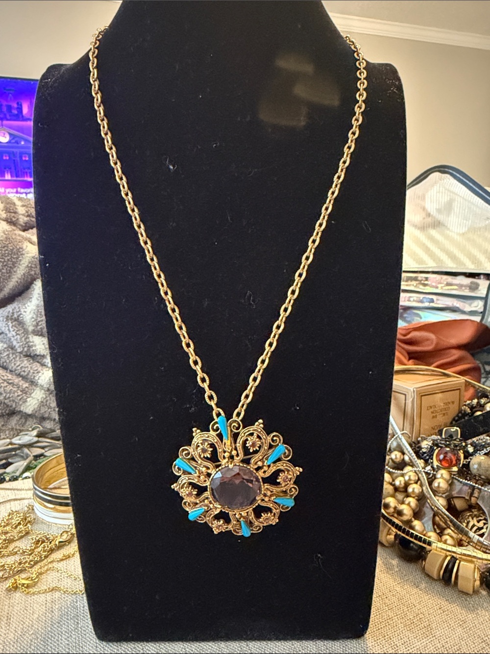 Gold Filigree Pendant Necklace with Turquoise Accents and Dark Center Stone